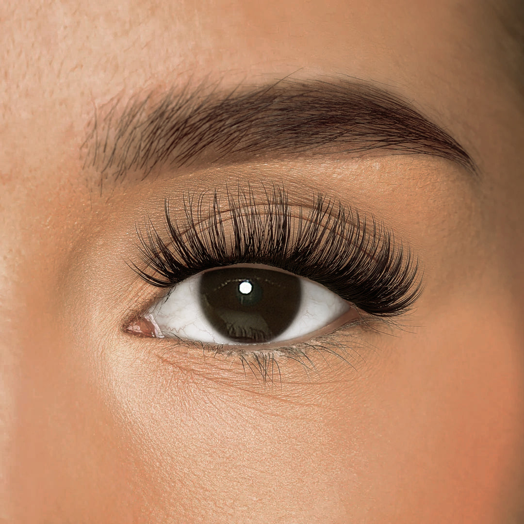 Close-up of iLash Mafia Bestie DIY lash extensions featuring lightweight lash clusters with soft volume, wispy texture, and natural-looking definition. The reusable at-home lash extensions create an eye-enhancing doll eye effect with a comfortable, seamless lash extension finish.