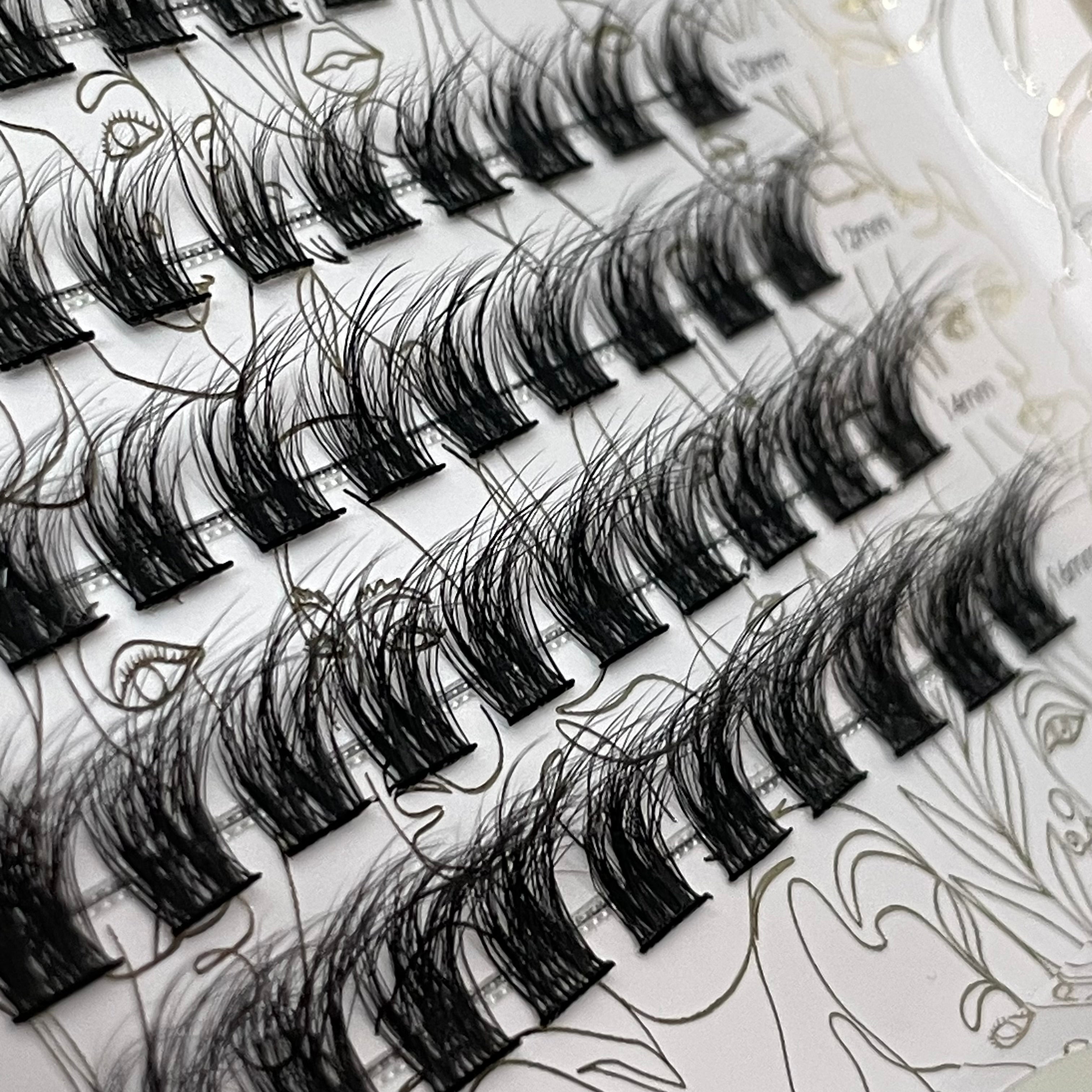 Close-up of iLash Mafia Bestie DIY lash clusters arranged on a tray, featuring lightweight lash segments with wispy texture and soft volume. The reusable at-home lash extensions allow customizable lash mapping for natural, doll eye, cat eye, and everyday lash styles.