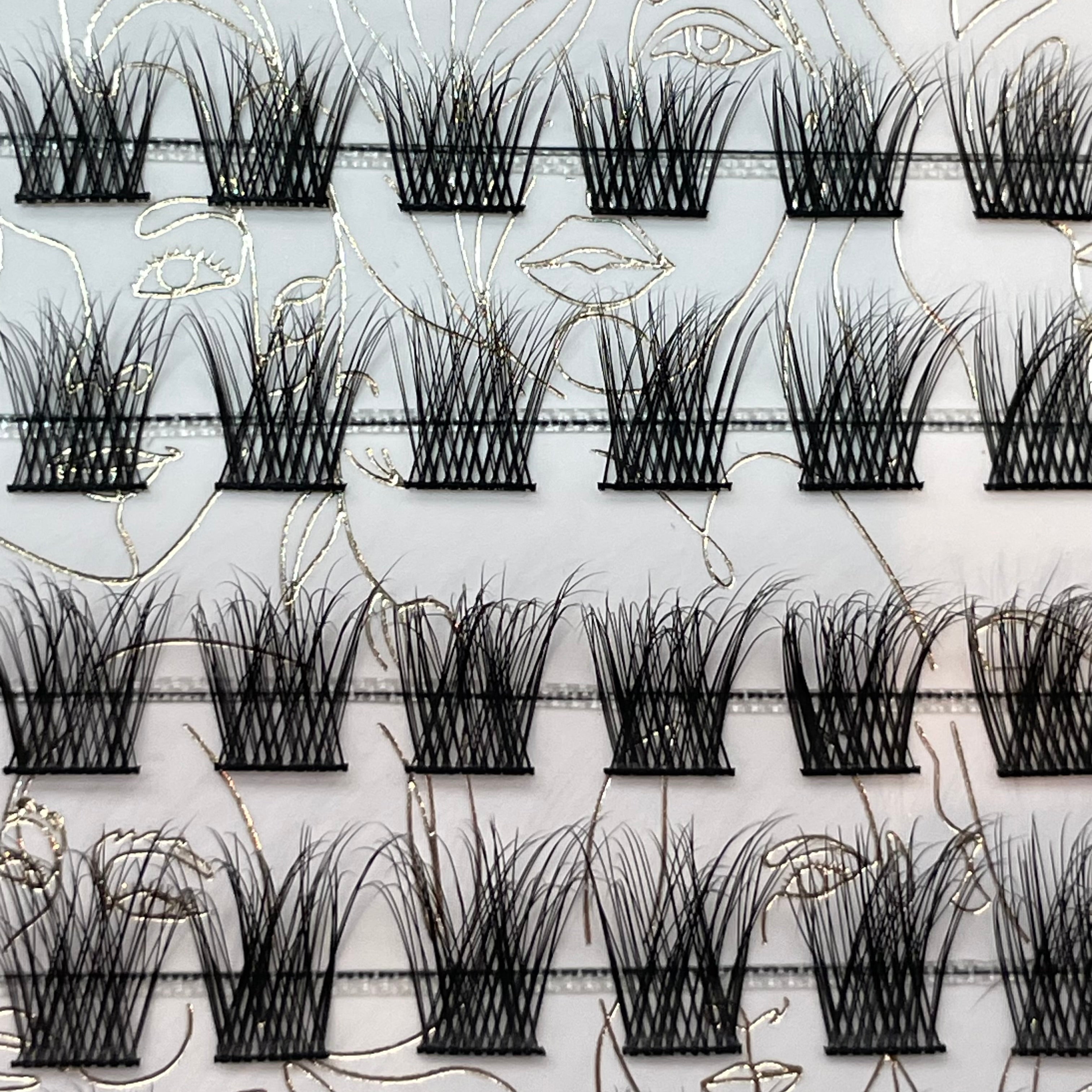 Close-up of iLash Mafia BUSSIN DIY lash clusters with soft volume, wispy texture, airy definition, and mixed lengths for customizable at-home lash extension styling.