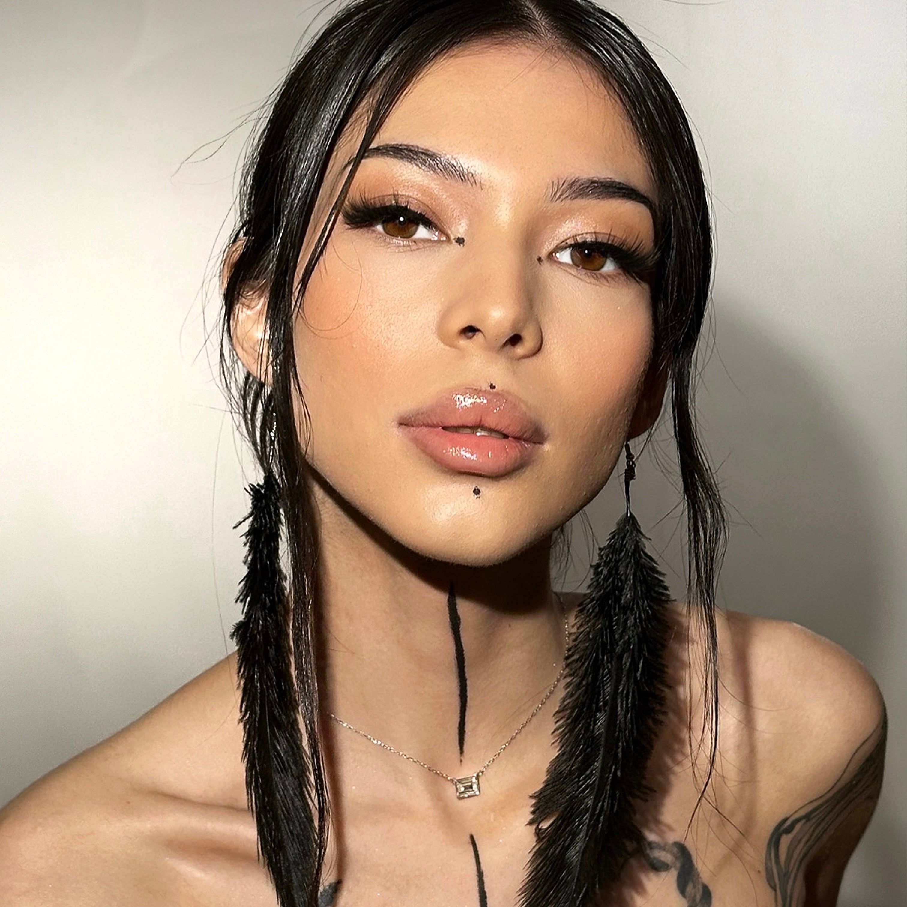 iLash Mafia MAIN CHARACTER DIY lash extensions model close-up showcasing full glam, wispy cat-eye volume lashes with a fluffy texture and lifted, winged outer corners